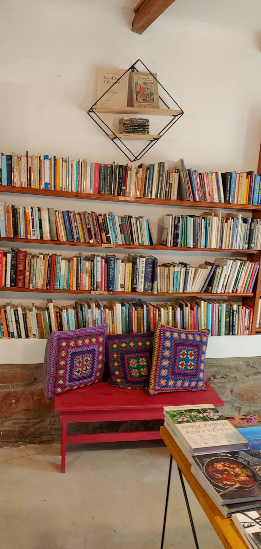 A reading corner with a red bench